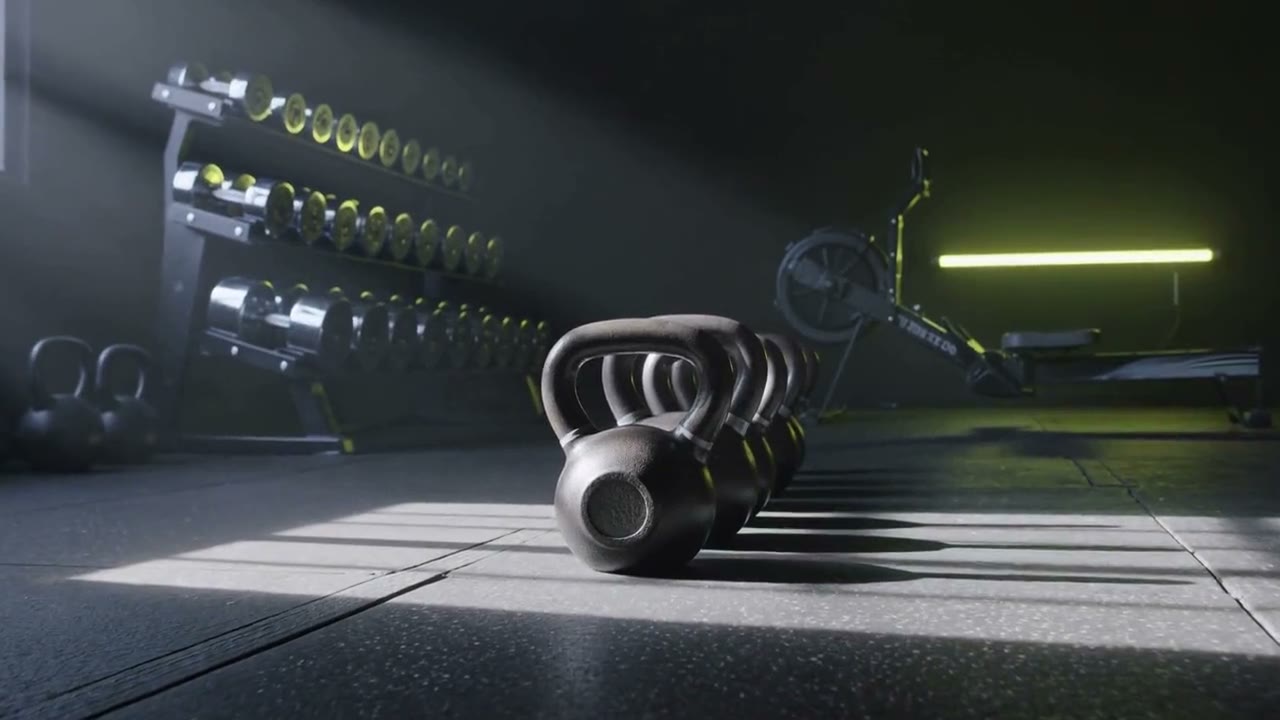 Kettlebells, a full dumbbell rack and a rowing machine in a high-performance gym